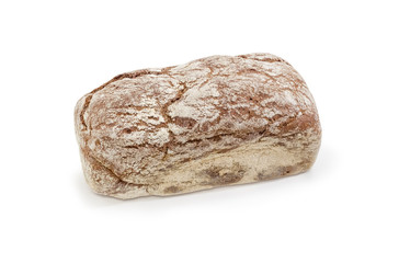 Whole loaf of the brown bread on a white background