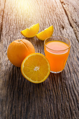 Glass of Fresh Orange Juice on grunge wooden table