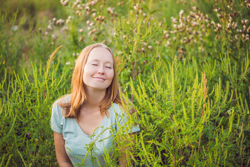 Young woman happy because no longer feels allergic to ragweed