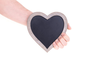 Adult holding heart shaped chalkboard