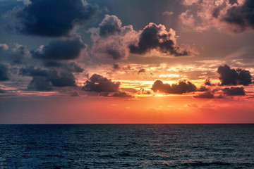 Beautiful stunning sunset at the sea, bright natural colors, background and texture