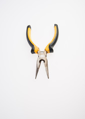 Pliers or Needle nose pliers on a background.