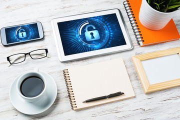 Web security and technology concept with tablet pc on wooden table