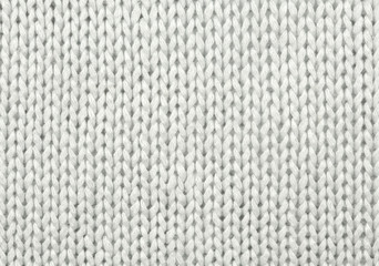 White wool texture. Texture of wool. Knitting natural wool white background.