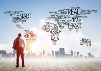 Motivation and inspiration concept with modern cityscape and businessman observing it