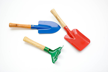 Gardening tools, spade, fork and rake  on white background