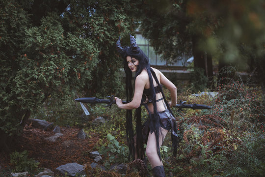 Beautiful brunette girl with a spear.