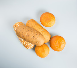 Hot dog bun and donut on a background.