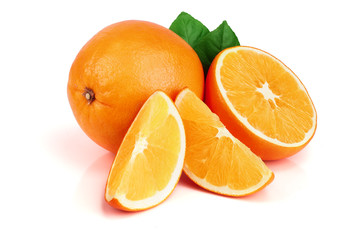 Fototapeta premium Orange with slice and leaf isolated on the white background