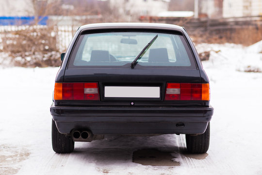 Old, Black, German Family Car Rear View In Winter