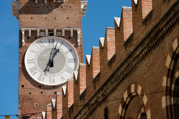 Fototapeta na wymiar Detail of medieval clock tower of Lamberti (Torre dei Lamberti) in Verona, Veneto, Italy