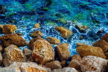 sea to rocks shore, close view