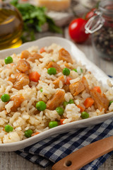 Delicious risotto with chicken and green peas.