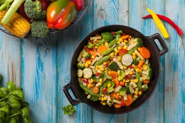 Foto auf Acrylglas Gemüse Mix of vegetables fried in a wok.