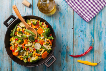 Mix of vegetables fried in a wok.