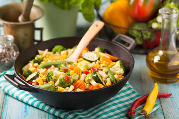 Mix of vegetables fried in a wok.