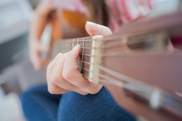 Music woman play acoustic guitar