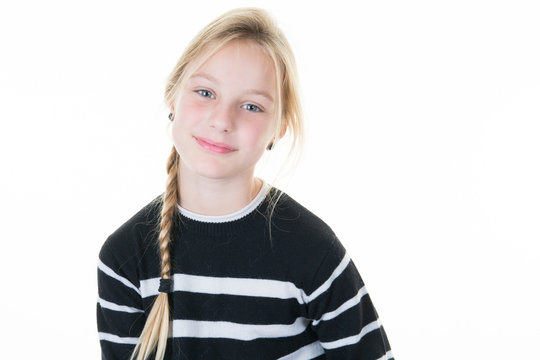 Portrait of a pretty young blond girl standing against white background