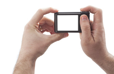 hands with compact digital camera taking photos isolated on white