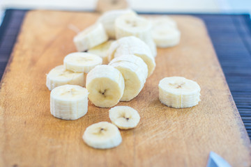 Chopped banana on wooden background