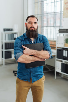 Confident bearded man staring intently at camera