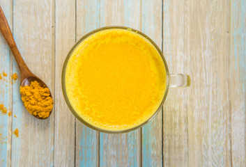 Golden turmeric milk top view. Healthy detox beverage