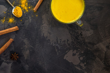 Golden turmeric milk with cinnamon. Healthy and aromatic detox beverage