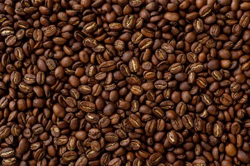 Texture, background. Roasted coffee beans, close up