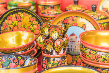Khokhloma utensils. Wooden spoons and bowls in in Russian folk style