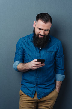 Relaxed casual guy reading a text message