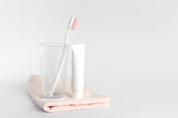 Toothbrushe and toothpaste rinse and towel on white background. Dental and healthcare concept. Free copy space.