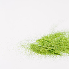 Green sparkles on a white background