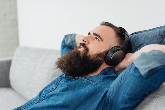 Happy relaxed man enjoying his music