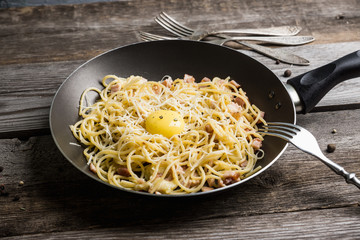 Fresh pasta Carbonara with meat and cheese. Selective focus.