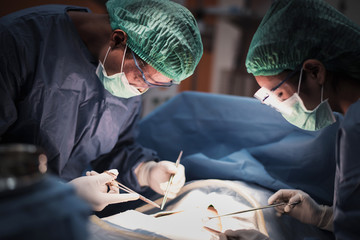 team of surgeons at working in the operating room 