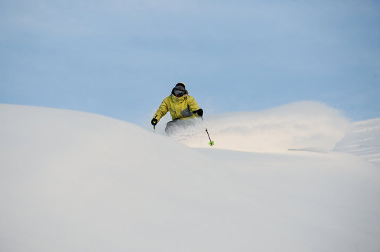 Professional snowboarder sliding down the snowy slope