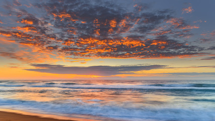 Vibrant Sunrise Seascape with Clouds