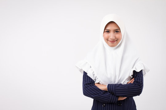 Confident Happy Smiling Muslim Business Woman; Studio Portrait Of Islamic Business Woman With Hijab, Head Scarf; Asian Businesswoman, Female Business Person Crossing Arms; Asian Girl Adult Model