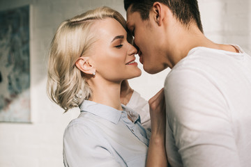 sexy young couple kissing at home