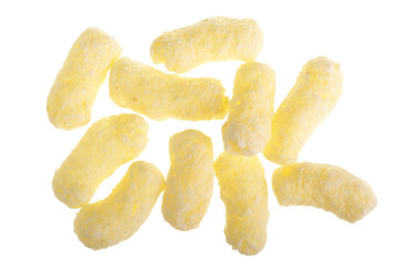 Sweet crunchy corn sticks or snacks isolated on white background. Top view. Flat lay