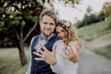 Beautiful bride and groom in green nature.