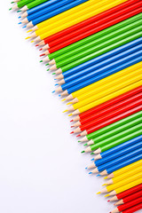 Colorful pencils pattern isolated on white background. Top view colorful of color pencils.Colored pencils, isolated on the white background. Color pencil with copy space isolated on white background,