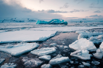 Winter landscape view of popular Glacier Lagoon with many small icebergs - Jokulsarlon, east Iceland. - Powered by Adobe