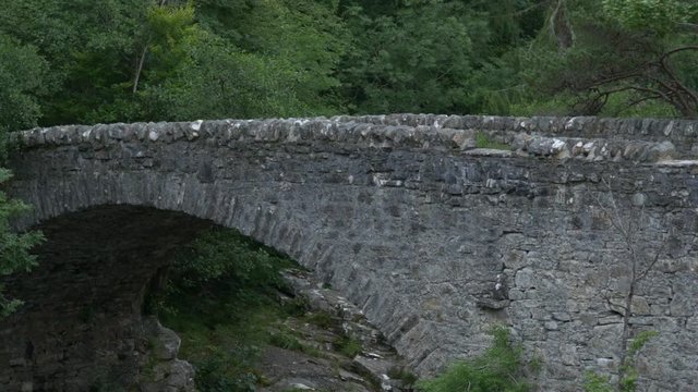 Pan left of a stone bridge