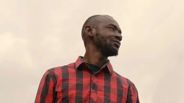 Young Black african man looking around- outdoor