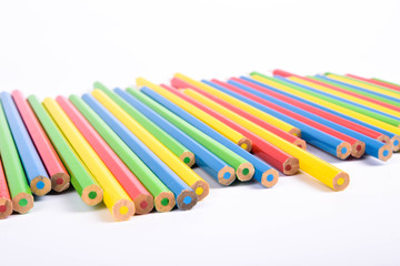  Colorful pencils pattern isolated on white background. Top view colorful of color pencils.Colored pencils, isolated on the white background. Color pencil with copy space isolated on white background,