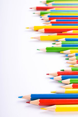  Colorful pencils pattern isolated on white background. Top view colorful of color pencils.Colored pencils, isolated on the white background. Color pencil with copy space isolated on white background,