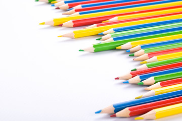  Colorful pencils pattern isolated on white background. Top view colorful of color pencils.Colored pencils, isolated on the white background. Color pencil with copy space isolated on white background,