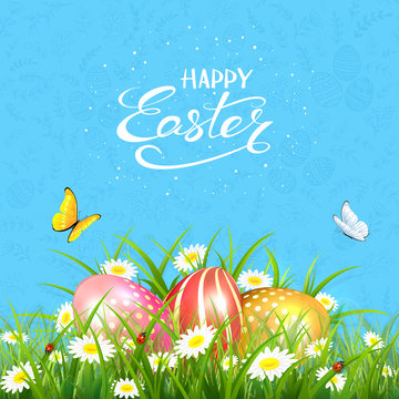 Blue background with butterflies and Easter eggs in grass