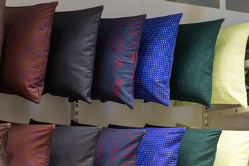 comfortable colorful fabric cushions on modern store shelves